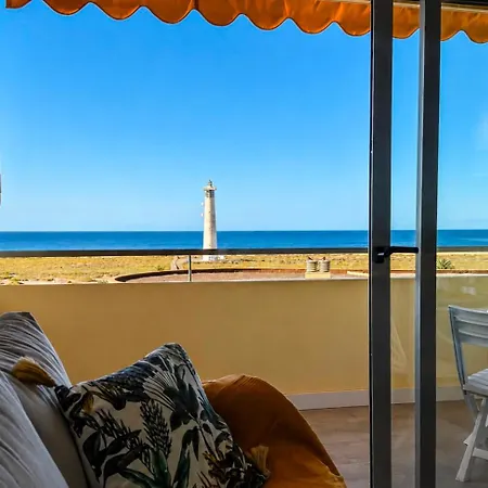 Faro Y Playa *